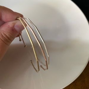 Gold, silver, and bronze thin bangles